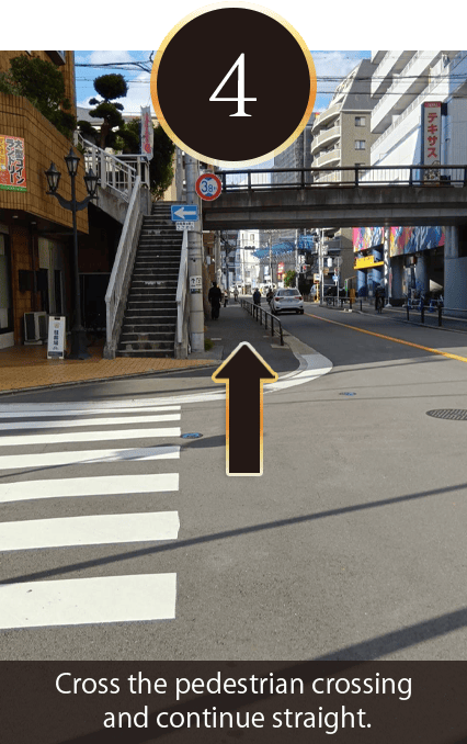 Cross the pedestrian crossing and continue straight.